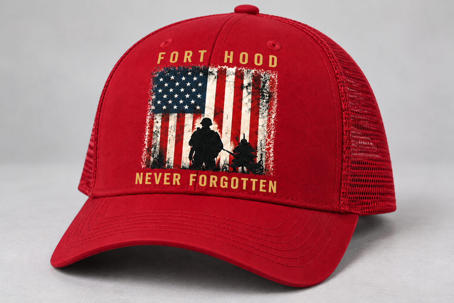 All-red cap mockup with gold Fort Hood and Never Forgotten lettering, an American flag and service-member silhouettes.